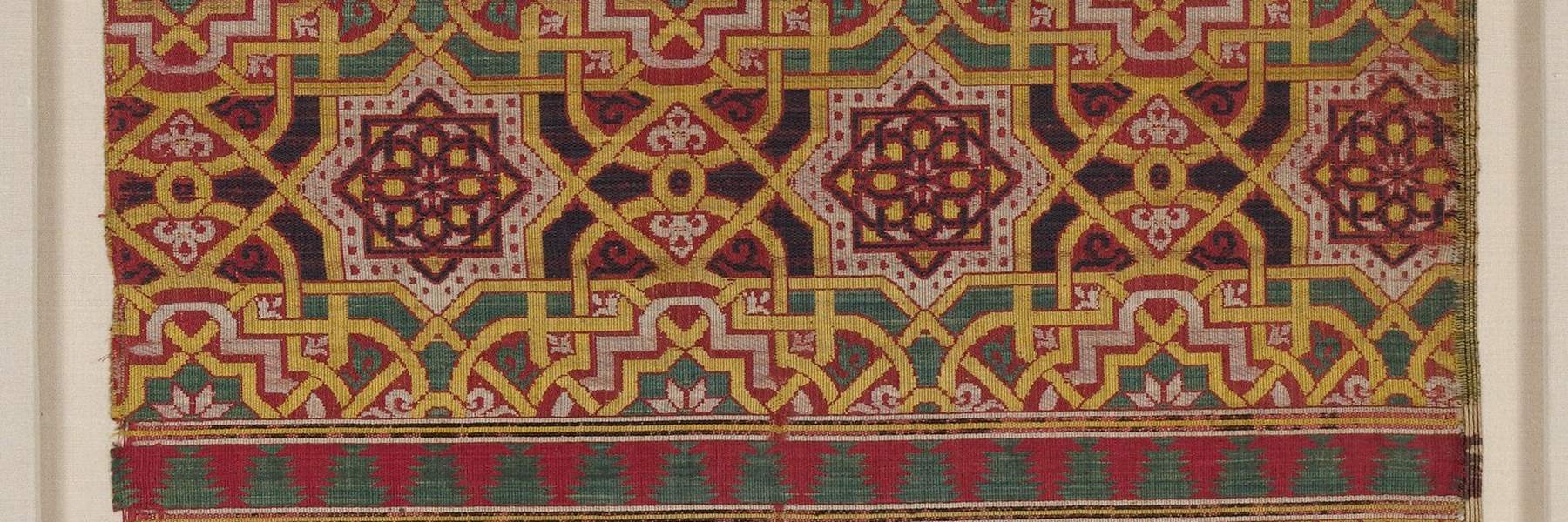A woven Iberian textile in red and gold