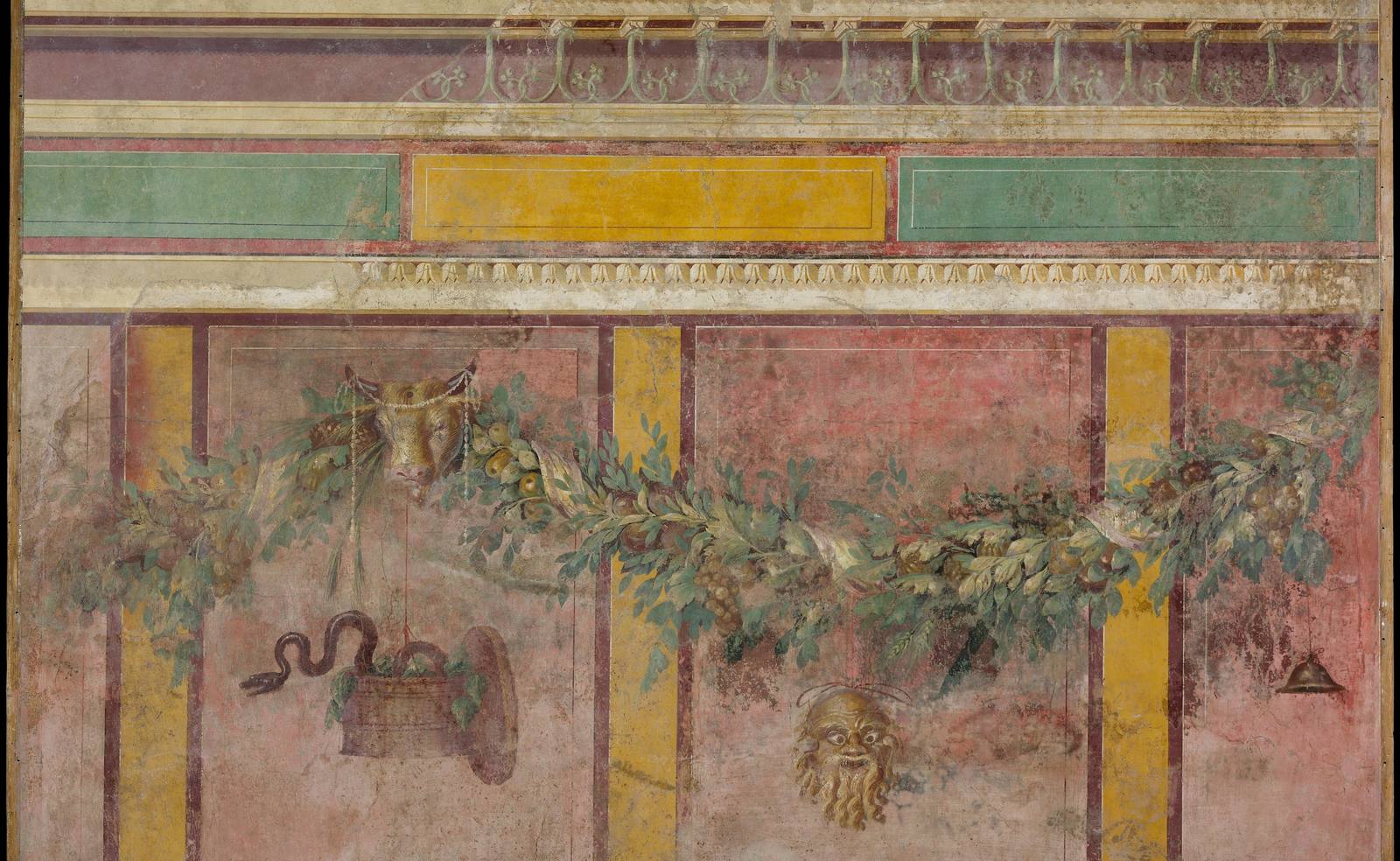 A Roman wall painting: garlands against panels of red, green and ochre